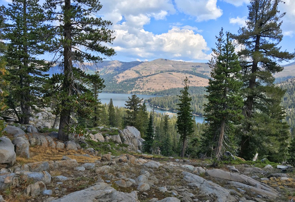 The Carson Emigrant National Recreation Trail offers scenic views of Caples Lake and the surrounding mountains.