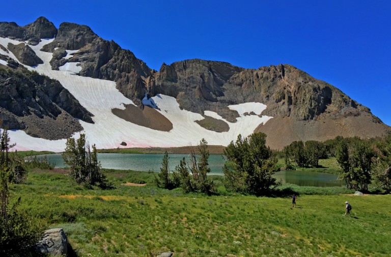 Round Top Lake sits below the Sisters, which tower over the lake at 9,000 feet in elevation.