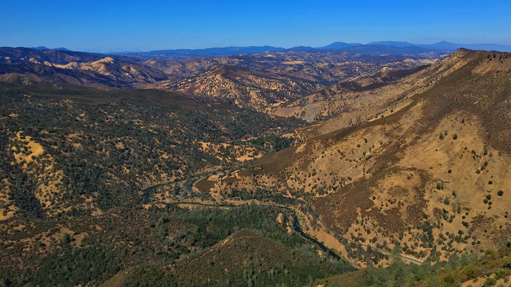 The view from the Blue Ridge Trail is sweeping as it looks into the Mendocino National Forest in the distance with Cache Creek in the foreground.