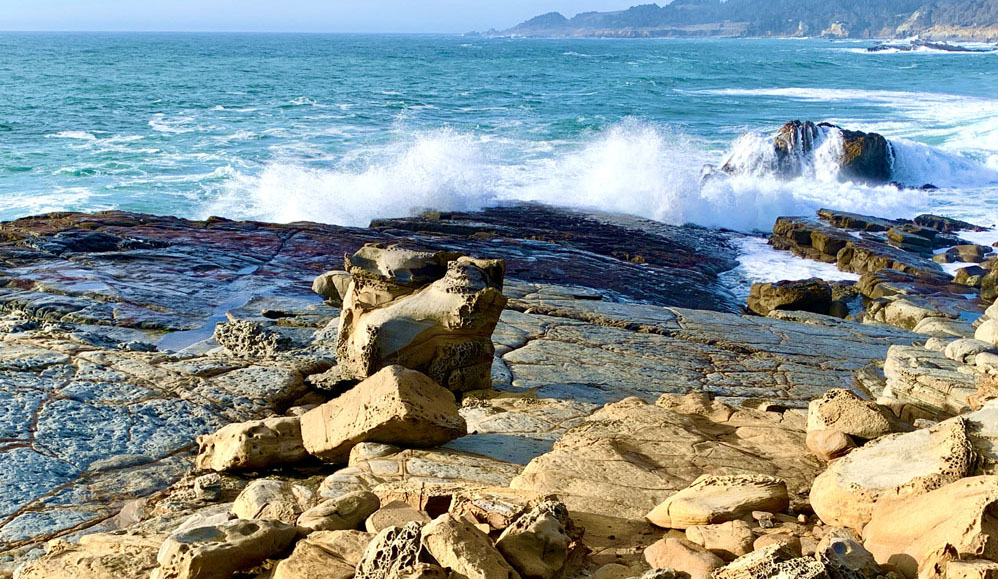 Waves from the Pacific Ocean crash into the shore at Salt Point State Park.