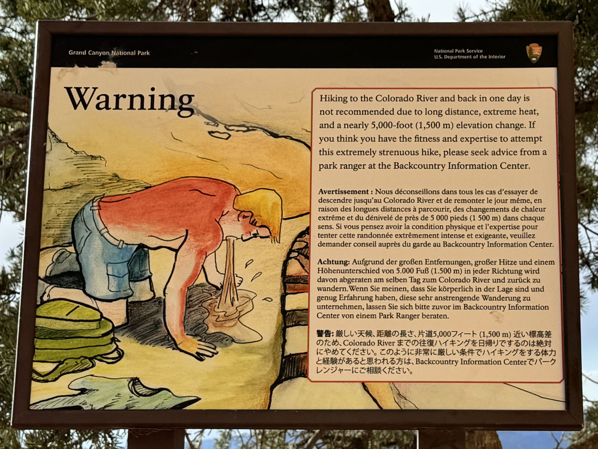 A sign showing the potential hazards of trekking down to the Colorado River and back in one day from about Ohh Ahh Point due to heat, distance, and elevation change.